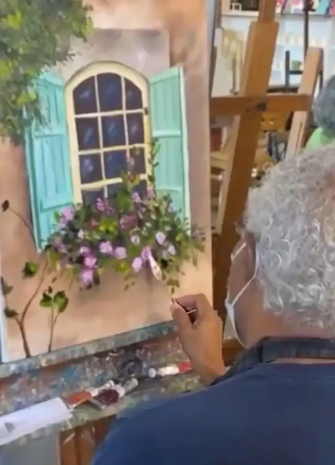 Adult student painting in class