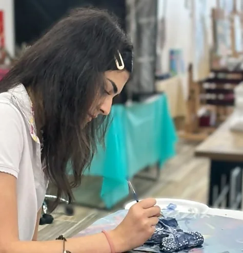 Teen student creating artwork